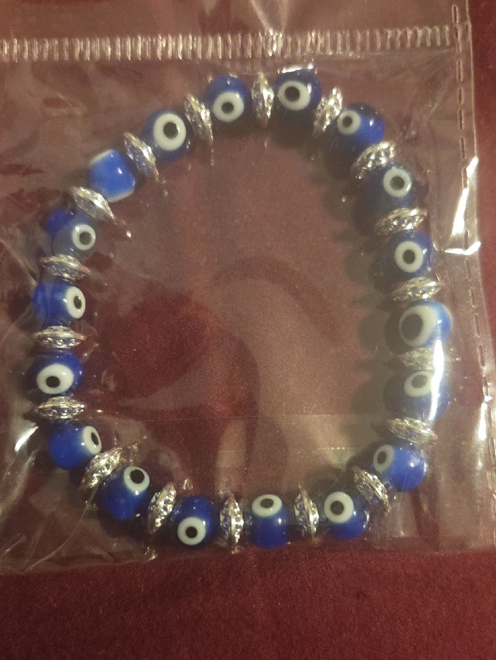 Blue Evil Eye Bead Stretch Bracelet with Silver Spacers